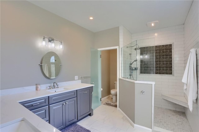 full bathroom with a walk in shower, toilet, recessed lighting, marble finish floor, and vanity