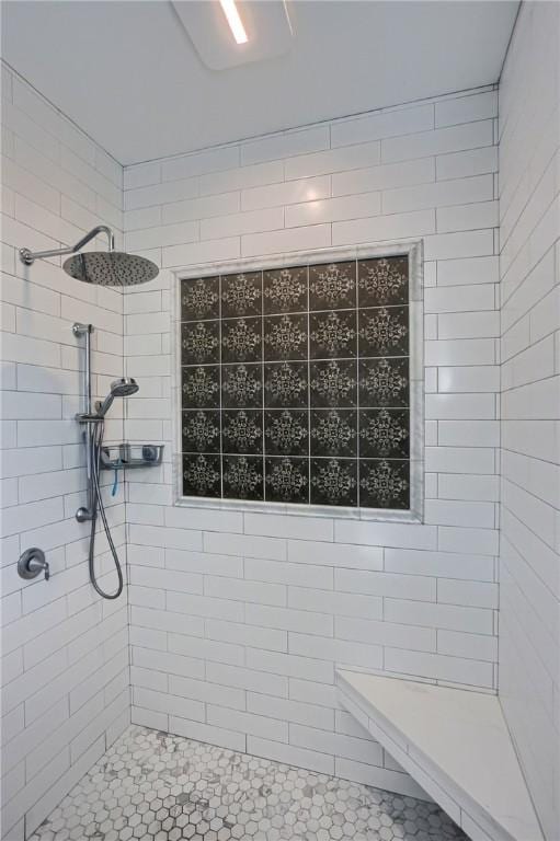 full bathroom featuring tiled shower