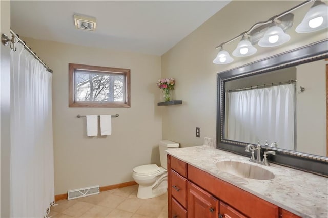 full bath with vanity, baseboards, visible vents, tile patterned flooring, and toilet