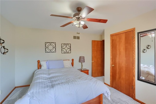 bedroom featuring carpet flooring, baseboards, visible vents, and ceiling fan