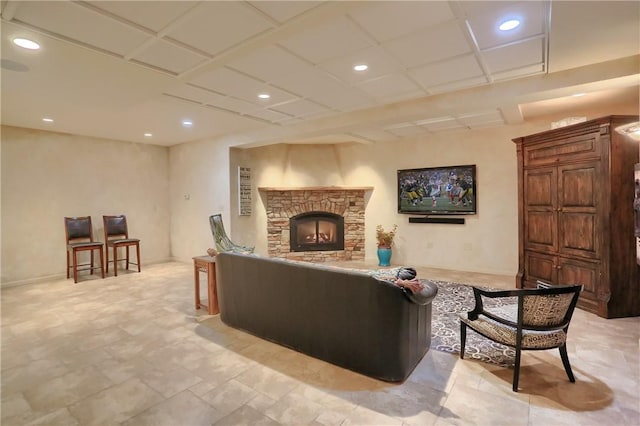 living room with recessed lighting and a fireplace