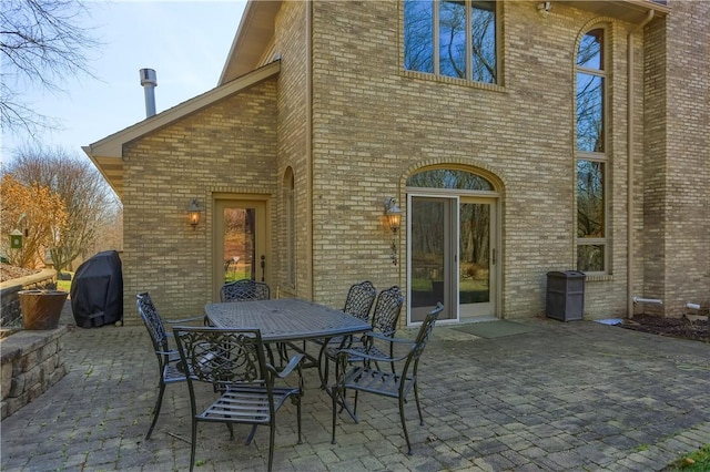 view of patio featuring area for grilling and outdoor dining area