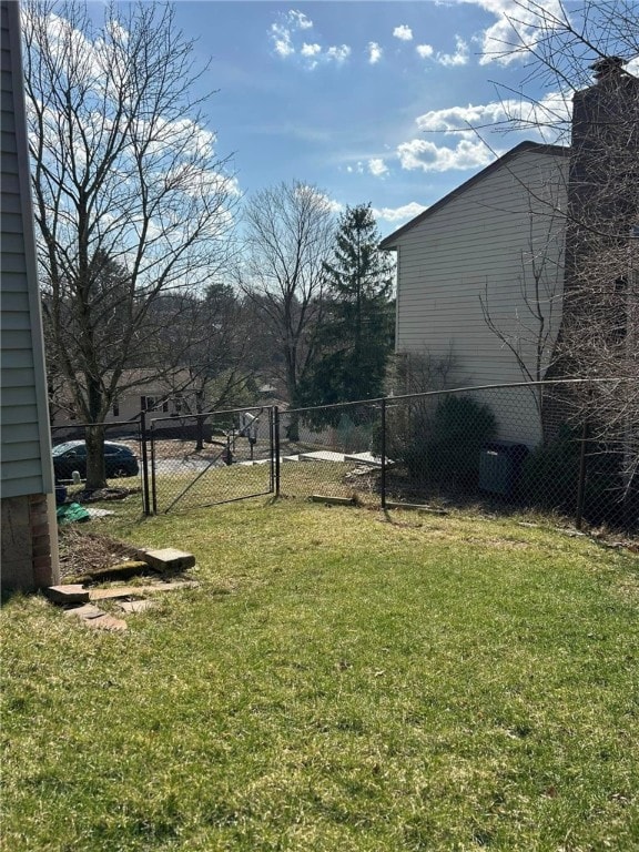 view of yard featuring a gate and fence