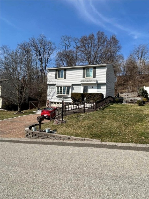 traditional home featuring a fenced front yard and a front lawn