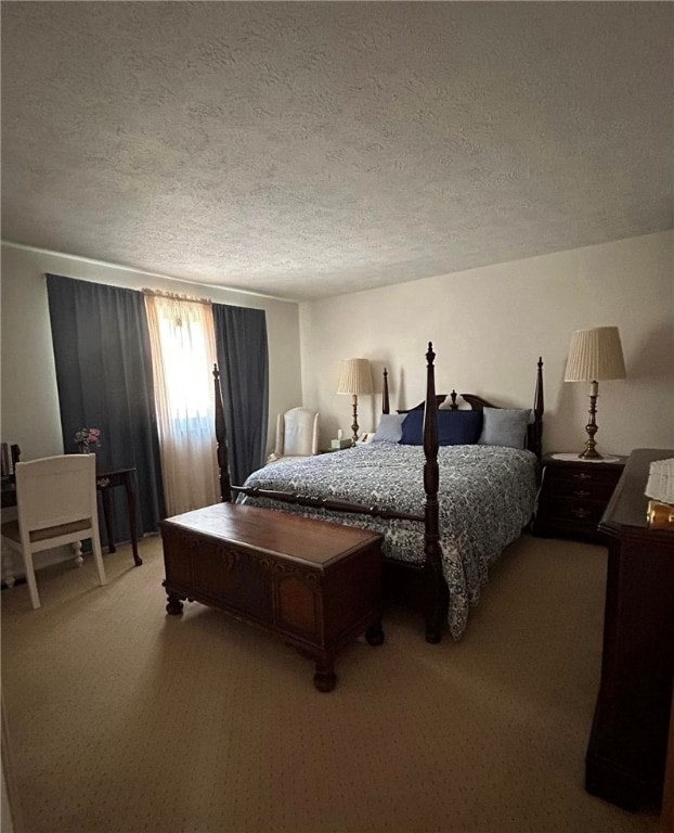 carpeted bedroom featuring a textured ceiling