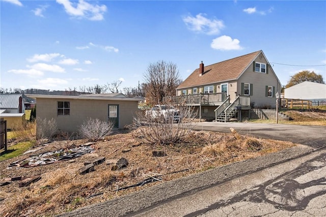 rear view of property with a chimney