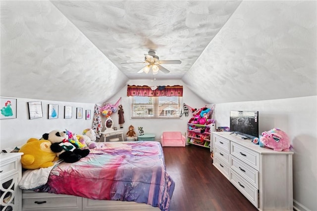 bedroom featuring a textured ceiling, dark wood-type flooring, ceiling fan, and vaulted ceiling