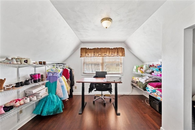 office featuring vaulted ceiling, wood finished floors, and baseboards