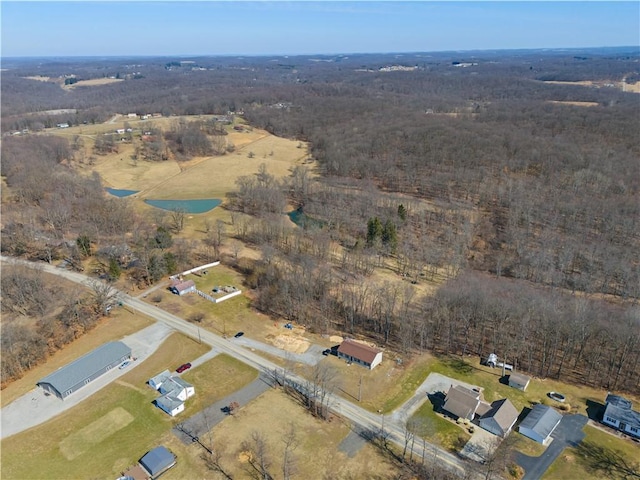 birds eye view of property with a rural view