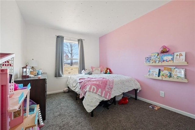 carpeted bedroom featuring baseboards