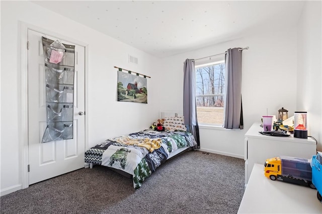 carpeted bedroom with baseboards and visible vents