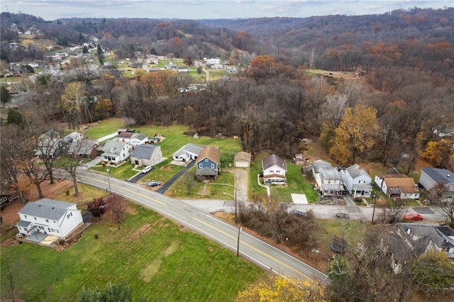 bird's eye view featuring a forest view and a residential view