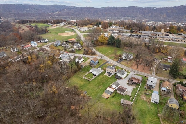 drone / aerial view featuring a forest view