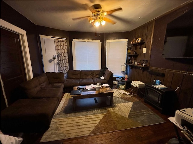 319 Cedar Ave, Sharon, PA 16146 - living room with wood walls, a ceiling fan, and wood finished floors