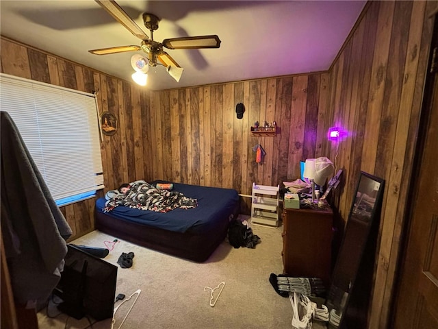 319 Cedar Ave, Sharon, PA 16146 - bedroom with a ceiling fan, wooden walls, and carpet