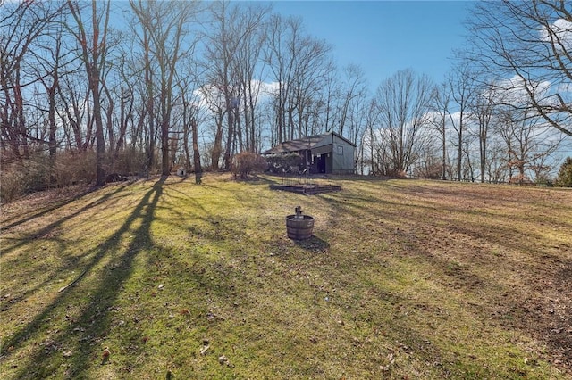 view of yard featuring a barn and an outdoor structure