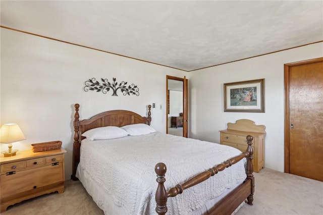 bedroom featuring light colored carpet