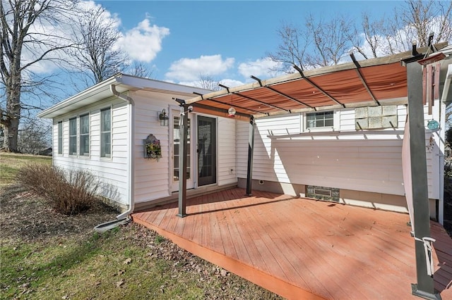 rear view of house with a pergola and a wooden deck