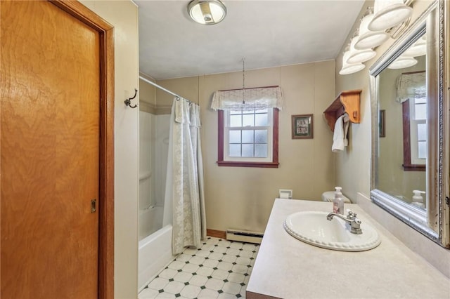 full bathroom featuring tile patterned floors, baseboard heating, vanity, and shower / bath combo