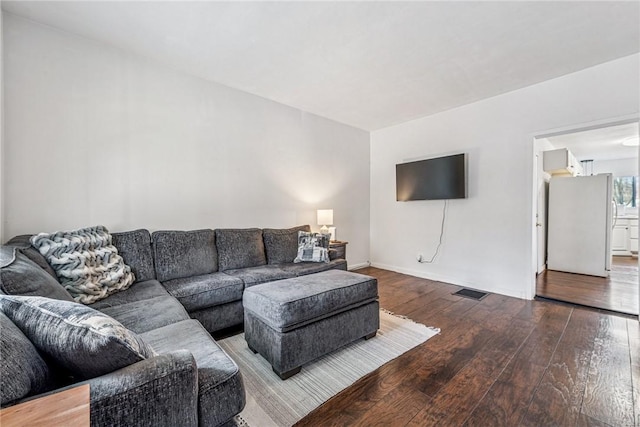 living area with wood-type flooring