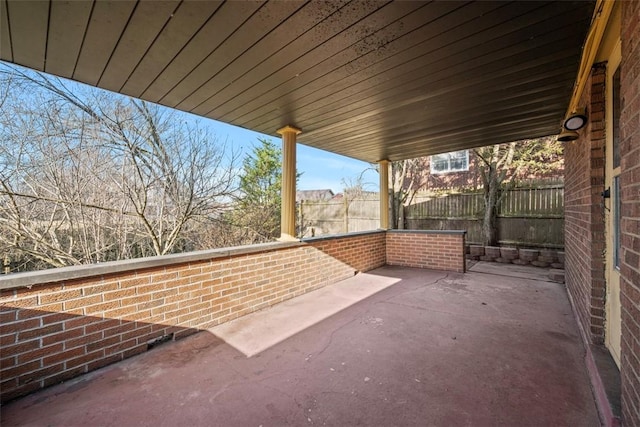 view of patio featuring fence