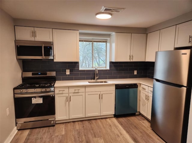 60 Broadhead Ave, Crafton, PA 15205 - kitchen featuring visible vents, stainless steel appliances, light wood-style floors, and a sink