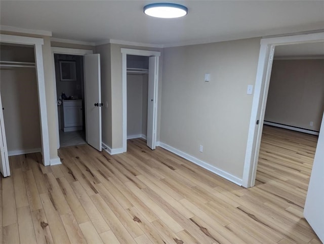 60 Broadhead Ave, Crafton, PA 15205 - unfurnished bedroom with light wood-style flooring, ornamental molding, multiple closets, and a baseboard radiator