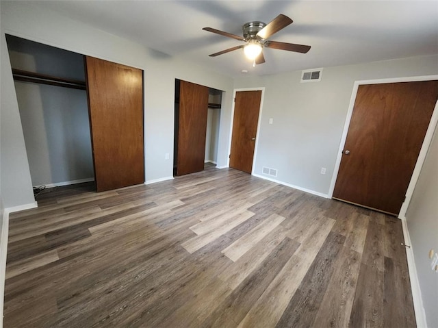 60 Broadhead Ave, Crafton, PA 15205 - unfurnished bedroom with dark wood finished floors, baseboards, visible vents, and two closets