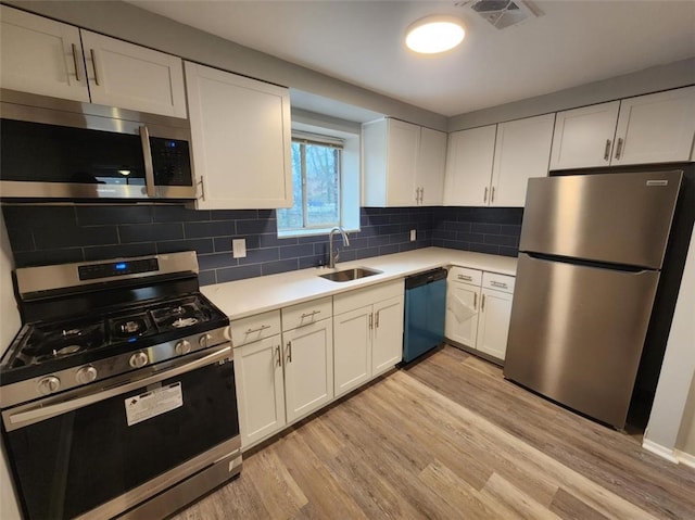 60 Broadhead Ave, Crafton, PA 15205 - kitchen featuring light wood finished floors, visible vents, light countertops, appliances with stainless steel finishes, and a sink