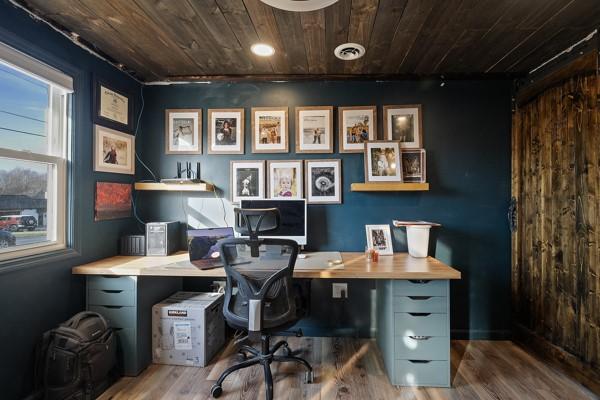 home office with visible vents, wooden ceiling, and wood finished floors