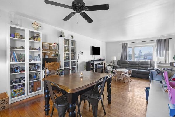 dining room featuring wood finished floors and ceiling fan