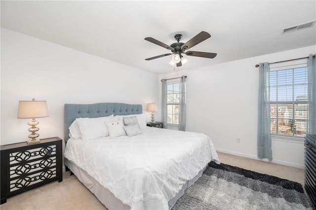 bedroom featuring visible vents, ceiling fan, baseboards, and carpet