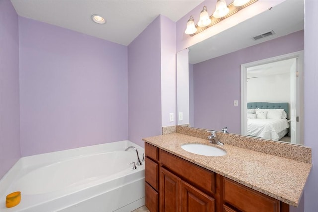 full bathroom with visible vents, ensuite bath, recessed lighting, a bath, and vanity