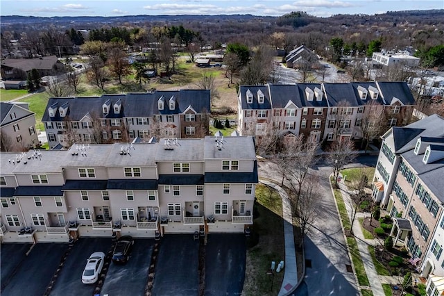 birds eye view of property with a residential view