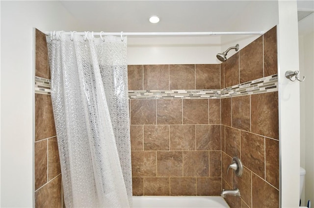 bathroom featuring shower / bath combo with shower curtain