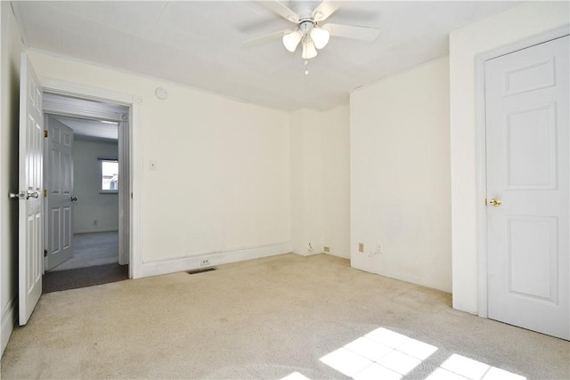 unfurnished bedroom featuring carpet and ceiling fan