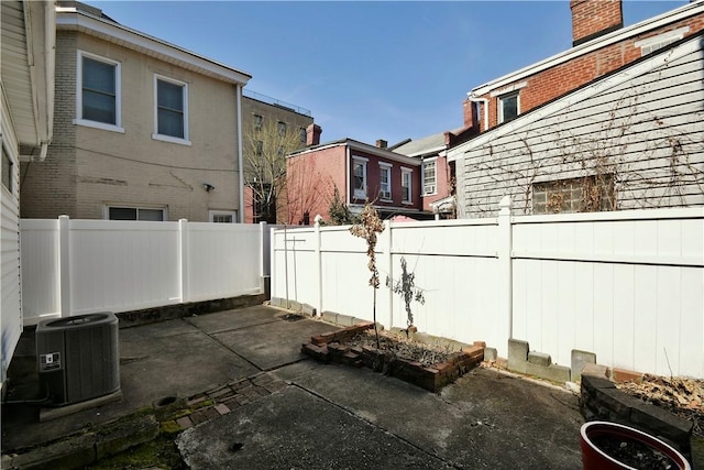 view of patio / terrace featuring a fenced backyard and central AC