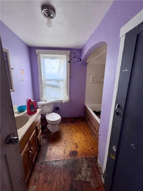 full bath with toilet, wood-type flooring, a bathtub, walk in shower, and vanity