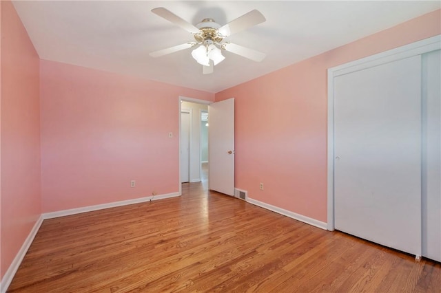 unfurnished bedroom with light wood finished floors and baseboards