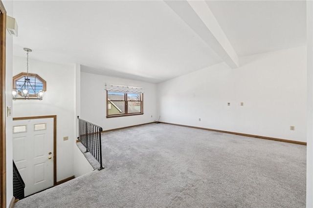 interior space with a chandelier, beam ceiling, and baseboards