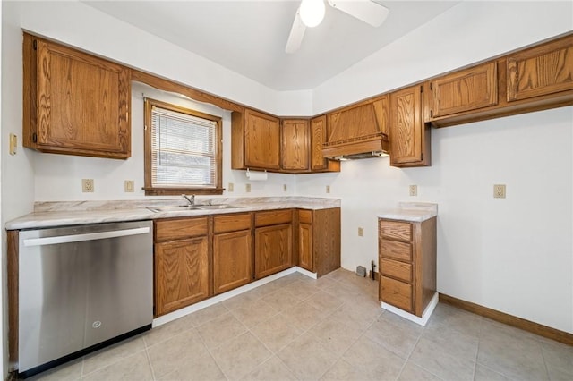 kitchen featuring a sink, light countertops, custom range hood, dishwasher, and brown cabinets