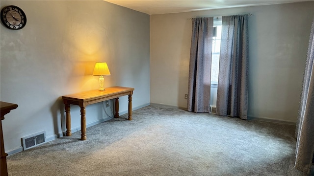 interior space with visible vents, baseboards, and carpet flooring