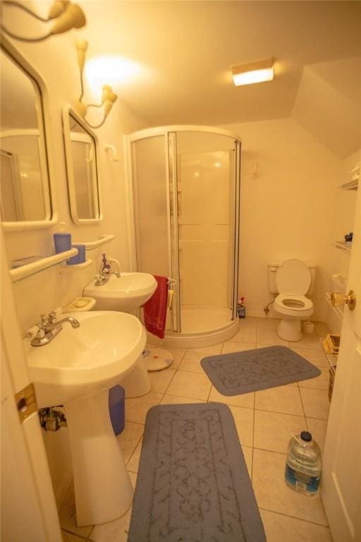 full bathroom with a sink, toilet, a shower stall, and tile patterned flooring