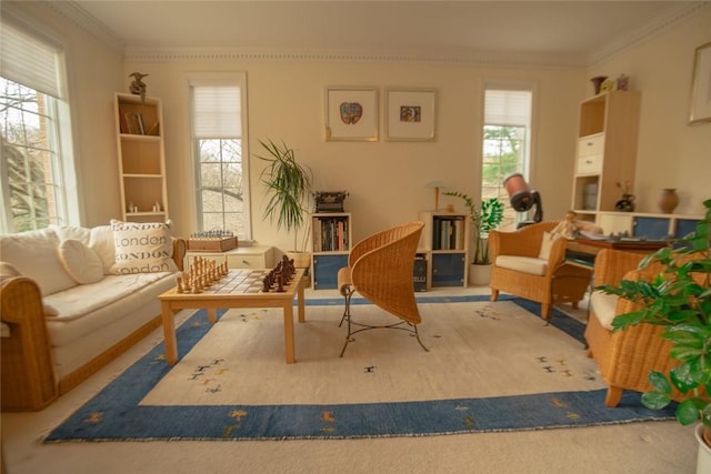 sitting room featuring carpet flooring and ornamental molding