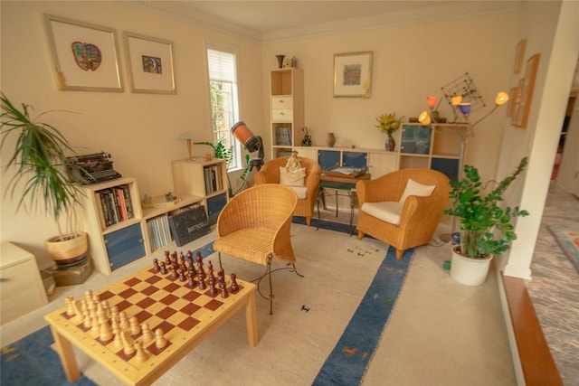 living area with carpet floors and crown molding