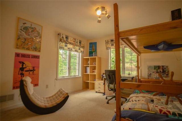 carpeted bedroom with visible vents