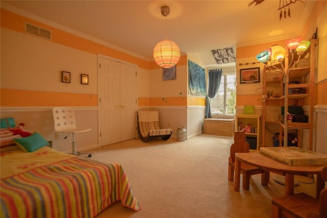 carpeted bedroom with visible vents and ornamental molding