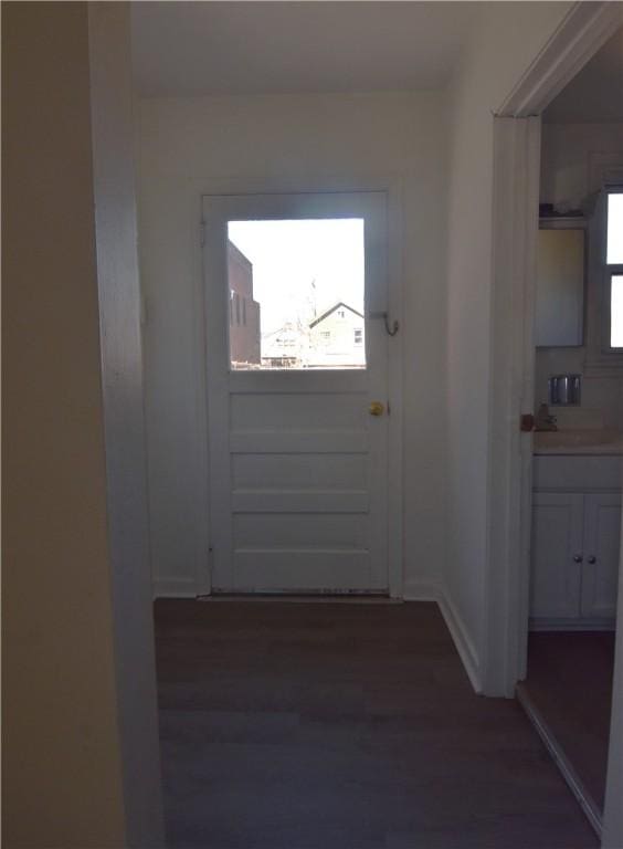 doorway to outside with wood finished floors