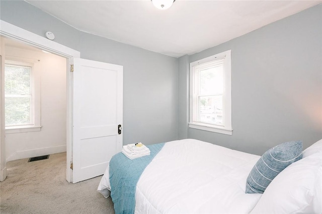 bedroom featuring visible vents and carpet