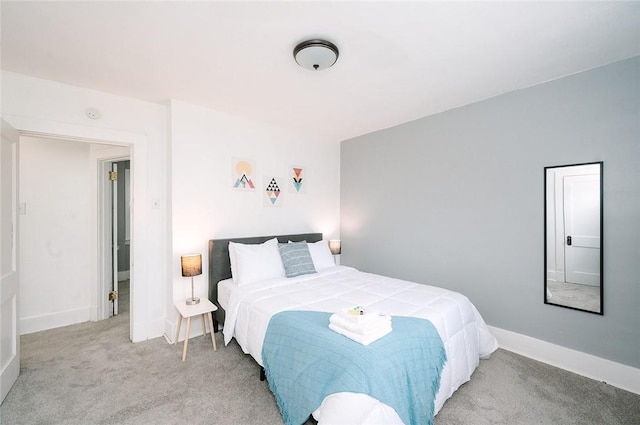 carpeted bedroom with baseboards